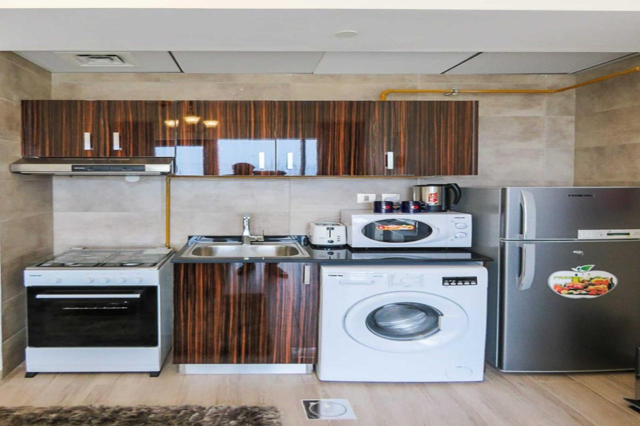 Oyo 860 Studio Apartment, Maya Tower 4, Jumeirah Village Triangle Dubaï Extérieur photo
