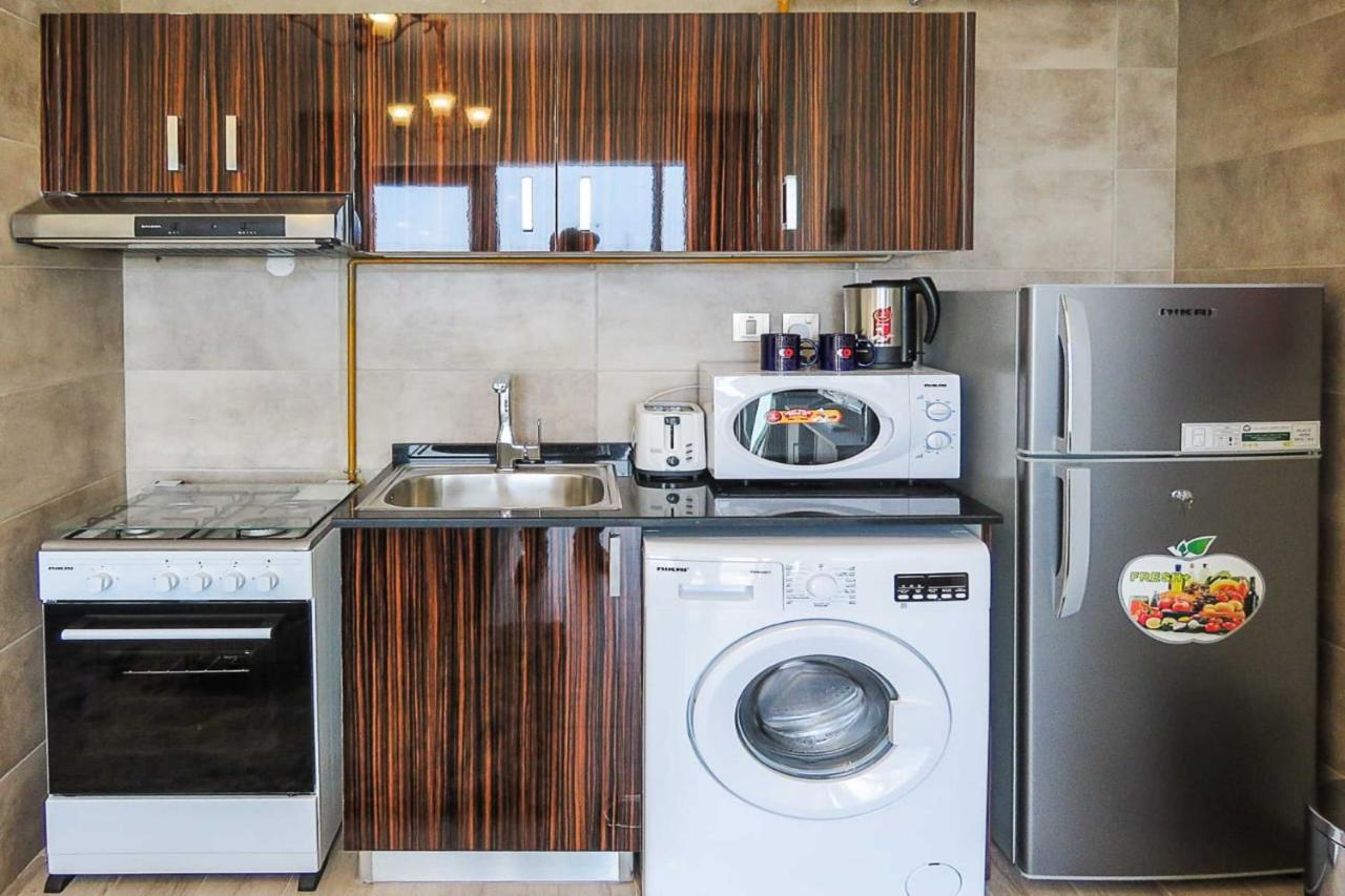Oyo 860 Studio Apartment, Maya Tower 4, Jumeirah Village Triangle Dubaï Extérieur photo