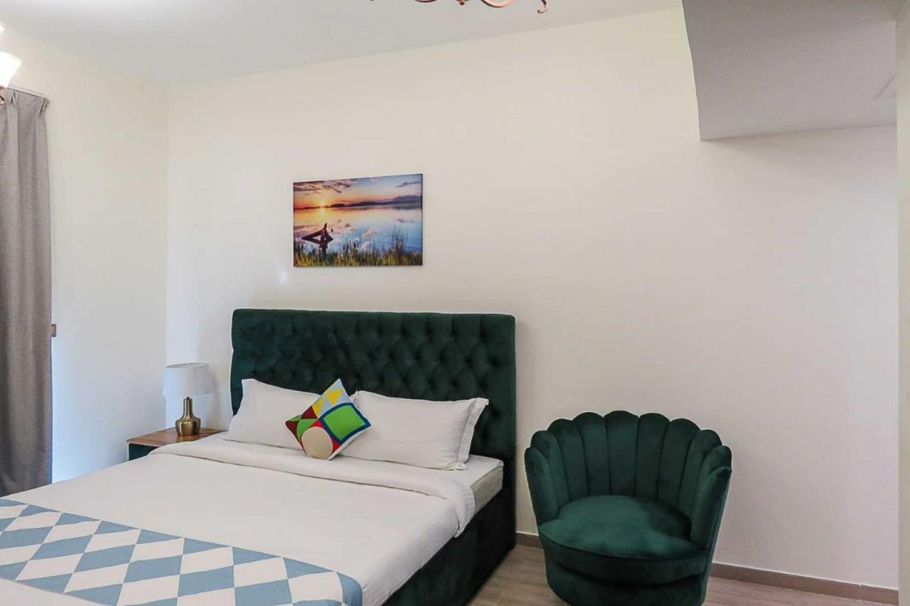 Oyo 860 Studio Apartment, Maya Tower 4, Jumeirah Village Triangle Dubaï Extérieur photo